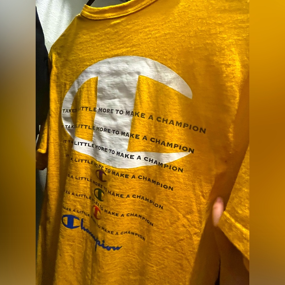 Champion shit yellow with wording on back
